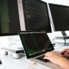 close up photo of person typing on laptop