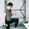 an elderly woman workout watch by the fitness coach